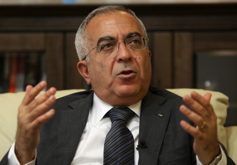 FILE - In this Tuesday, June 28, 2011 file photo, Palestinian Prime Minister Salam Fayyad speaks during an interview with The Associated Press in the West Bank city of Ramallah. A spokesman says Fayyad has been hospitalized with an abdominal infection on Monday, April 1, 2013. (AP Photo/Majdi Mohammed, File)