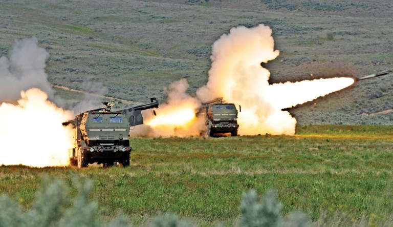 Two rounds are fired from High Mobility Artillery Rocket systems at Yakima Training Center in Washington, May 24, 2011.