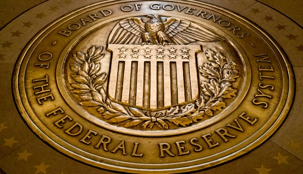 Fed official hints at tapering bond purchases as economy heats up