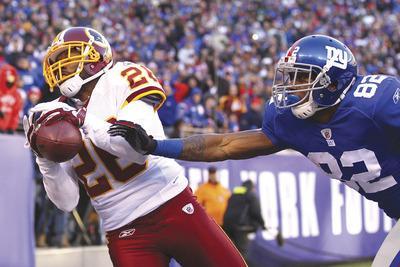 Cornerback Josh Wilson had one of the Redskins'three interceptions of Eli Manning in a 23-10 victory Sunday that gave them a season sweep of the NFC East rival Giants.