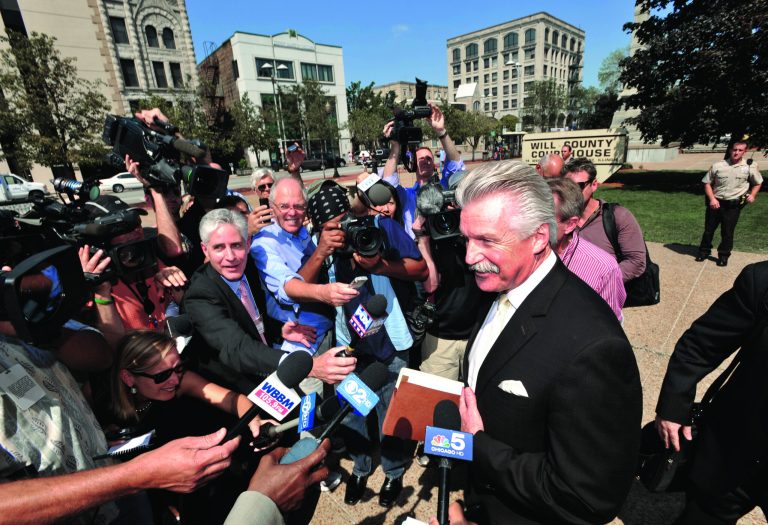 Will County State's Attorney James Glasgow speaks to the media outside the Will County Courthouse after the second day of the murder trial of Drew Peterson, Wednesday, Aug. 1, 2012 in Joliet, Ill.. Peterson, 58, is charged with killing his third wife, Kathleen Savio, in 2004. Her body was found in a dry bathtub in her home, her hair soaked with blood. He is also a suspect in the 2007 disappearance of his fourth wife, Stacy Peterson. (AP Photo/Paul Beaty)