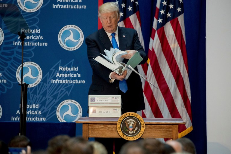 Now, the president has started using props, perhaps consciously inspired by previous presidents. (AP Photo/Andrew Harnik)