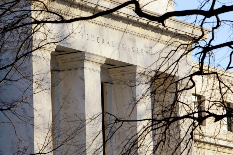FILE - In this Thursday, Jan. 14, 2010, file photo, the Federal Reserve Building is seen in Washington. The Federal Reserve said Wednesday, Oct. 16, 2013, that economic growth slowed in a few key regions of the United States from September through early October, as businesses grew worried about a budget impasse that led to a partial government shutdown. (AP Photo/Alex Brandon, File)