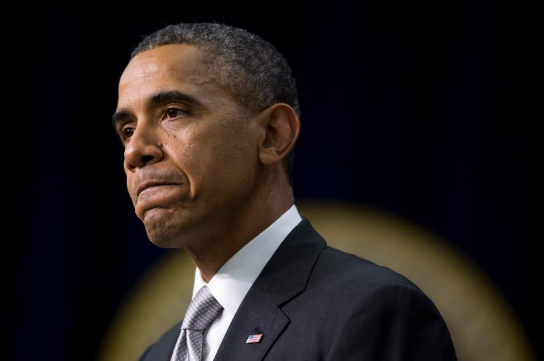 President Barack Obama pauses as he speaks about the new health care law, Tuesday, Dec. 3, 2013, in the South Court Auditorium in the Eisenhower Executive Office Building on the White House complex in Washington. The president said his signature health care law 