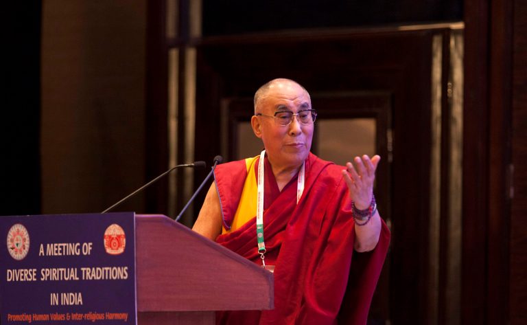 Tibetan spiritual leader the Dalai Lama speaks during an inter-faith meeting in New Delhi, India, Saturday, Sept. 20, 2014. The Dalai Lama brought religious leaders together Saturday to mull some of India's most pressing problems, from gender violence to widespread poverty, while praising the country's religious harmony as proof to the world that different communities can live peacefully together. (AP Photo/Tsering Topgyal)
