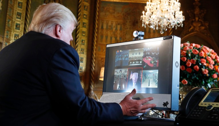 President Donald Trump speaks with members of the armed forces via video conference at his private club, Mar-a-Lago, on Thanksgiving, Thursday, Nov. 23, 2017, in Palm Beach, Fla. (AP Photo/Alex Brandon)