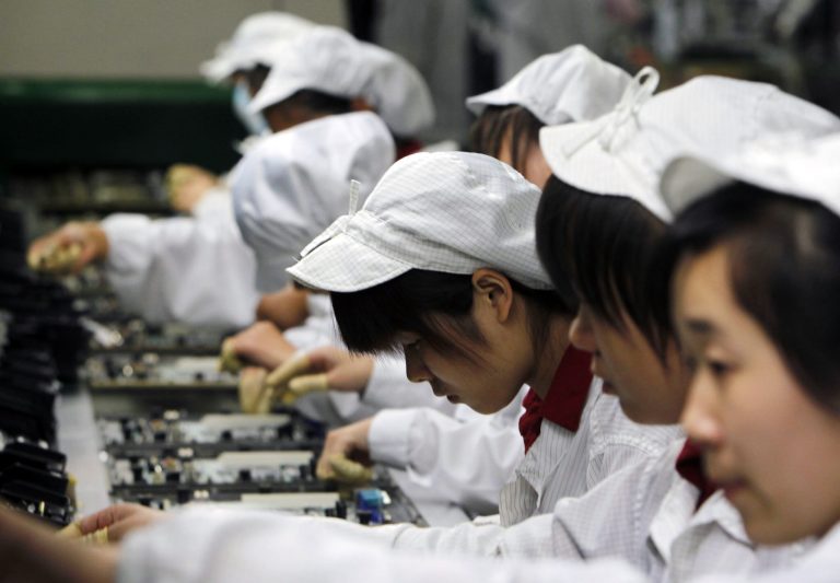 An investigation found that Chinese employees work more than 60 hours a week for less than $2 an hour. (AP Photo/Kin Cheung, File)