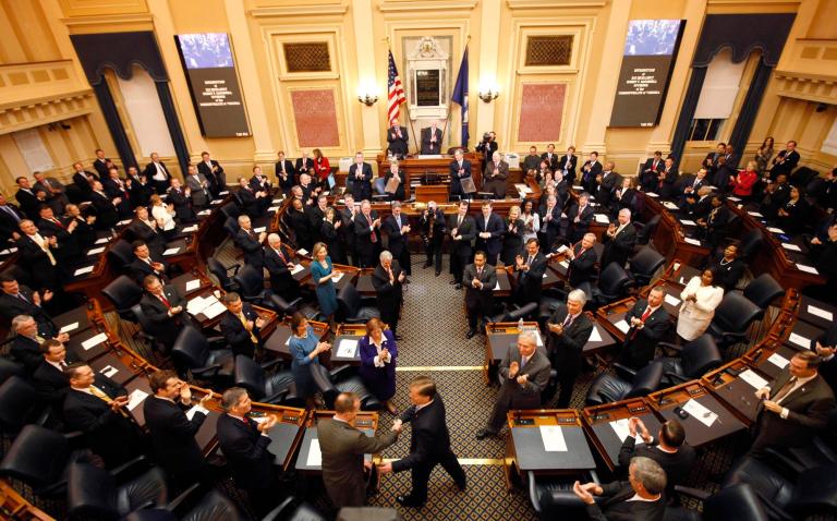 Virginia Gov. Bob McDonnell, center, shakes the hand of Del. Rob Bell, R-Albermarle, as he arrives to deliver his State of the Commonwealth address before a joint session of the Virginia General Assembly in the House chambers at the Capitol in Richmond, Va., Wednesday, Jan. 11, 2012.