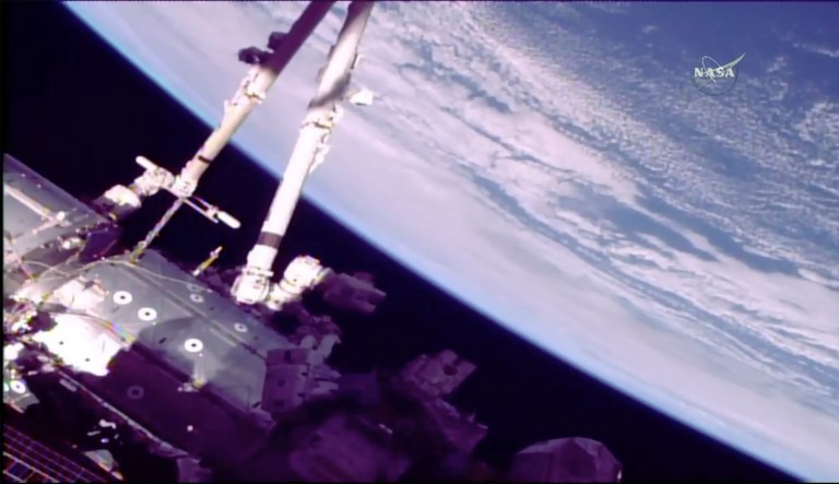 This photo provided by NASA shows astronauts Norishige Kanai of Japan, left, and NASA astronaut Mark Vande Hei during a spacewalk on the International Space Station on Feb. 16, 2018. (NASA via AP)