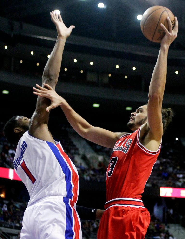  Chicago Bulls center Joakim Noah, right, goes to the basket against Detroit Pistons forward Andre Drummond (1) during the first half of an NBA basketball game, Friday, Dec. 7, 2012, in Auburn Hills, Mich. (AP Photo/Duane Burleson)  