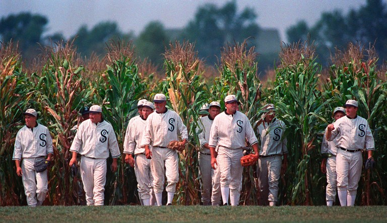In this undated file photo, people portraying ghost players emerge from a cornfield as they reenact a scene from the movie "Field of Dreams" at the movie site in Dyersville, Iowa. It's been 30 years since the film was released. 