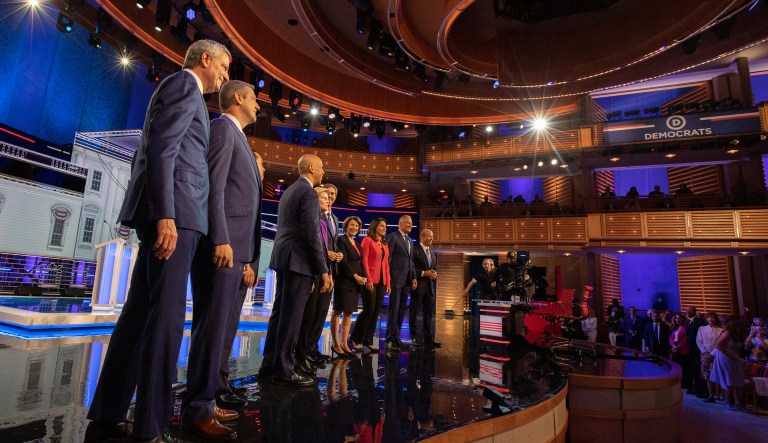 2020 Democratic presidential candidates Bill de Blasio, mayor of New York City, from left, Representative Tim Ryan, a Democrat from Ohio, Julian Castro, former secretary of Housing and Urban Development (HUD), Senator Cory Booker, a Democrat from New Jersey, Senator Elizabeth Warren, a Democrat from Massachusetts, Beto O'Rourke, former Representative from Texas, Senator Amy Klobuchar, a Democrat from Minnesota, Representative Tulsi Gabbard, a Democrat from Hawaii, Jay Inslee, governor of Washington, and Former Representative John Delaney stand on stage during the Democratic presidential candidate debate in Miami, Florida, U.S., on Wednesday, June 26, 2019. Democratic presidential candidates tangled on health care in their firstÂ debateÂ Wednesday, agreeing on the need for universal coverage but disagreeing about whether private insurance should be maintained.