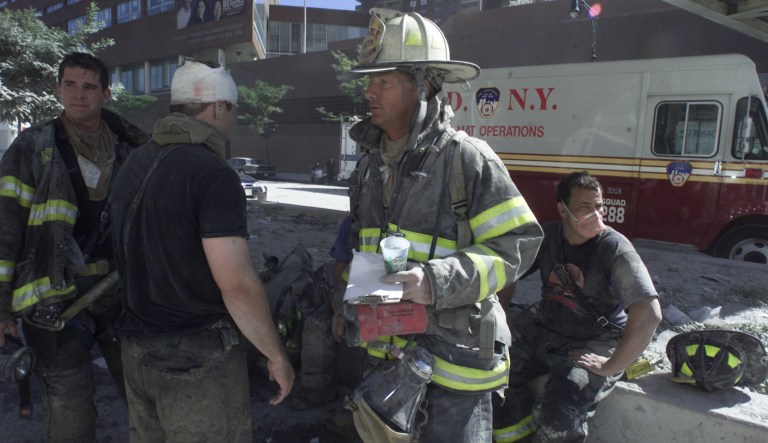 Anxious family members watch a rescue vehicle pass by, Wednesday, Feb. 14, 2018, in Parkland, Fla. A shooting at Marjory Stoneman Douglas High School school sent students rushing into the streets as SWAT team members swarmed in and locked down the building.