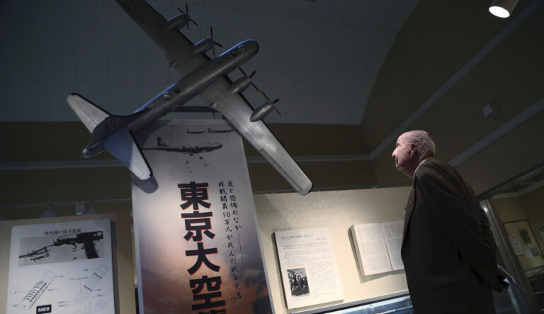 Fiske Hanley of Fort Worth, TX, an American World War II veteran who took part in firebombing of Tokyo and was later held captive by the Japanese 70 years ago, watches scale model of B-29 bomber at the Center of the Tokyo Raids and War Damage in Tokyo Wednesday, Dec. 9, 2015.