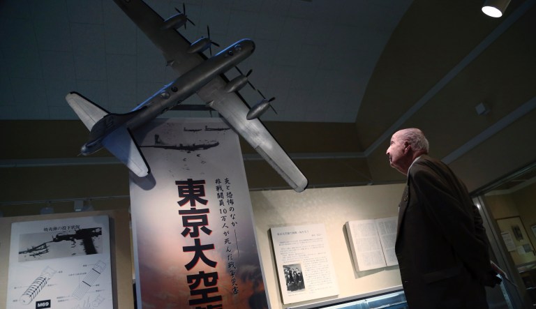 Fiske Hanley of Fort Worth, TX, an American World War II veteran who took part in firebombing of Tokyo and was later held captive by the Japanese 70 years ago, watches scale model of B-29 bomber at the Center of the Tokyo Raids and War Damage in Tokyo Wednesday, Dec. 9, 2015.