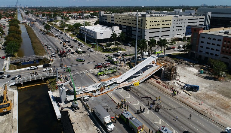 A survivor of the pedestrian bridge collapse at Florida International University has filed the first lawsuit against the companies that designed and built the bridge. (DroneBase via AP)