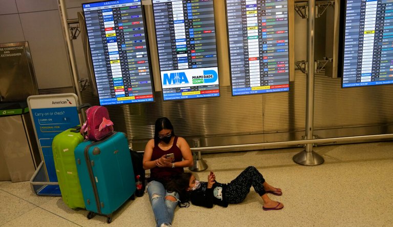 At Phoenix Sky Harbor International Airport, departure signs show regional jet cancellations and American Airlines says seven regional flights have been delayed and 43 have been canceled because of a heat wave as temperatures climb to near-record highs Tuesday, June 20, 2017, in Phoenix.