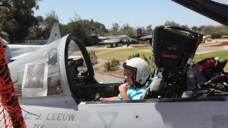 Conner Brashear, 6, sits inside the cockpit of the McDonnell Douglas F/A-18 Hornet during an Open Cockpit Day July 9, 2011. These events are scheduled throughout the summer and allow Marines and their families to sit in various aircraft on display.