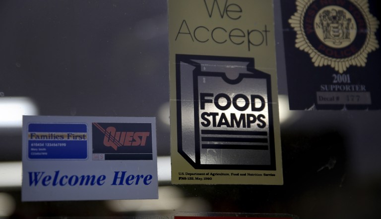 A supermarket displays stickers indicating it accepts food stamps in West New York, New Jersey, on Monday, Jan. 12, 2015.