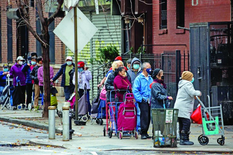 People line up outside a food pantry in Brooklyn, New York, on Nov. 12.