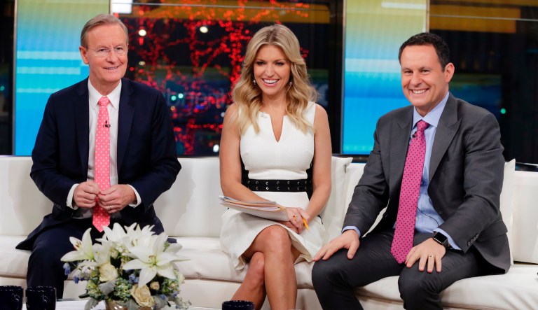 FILE - In this Jan. 17, 2018 file photo, "Fox & Friends" co-hosts, from left, Steve Doocy, Ainsley Earhardt and Brian Kilmeade appear on their set in New York. Roughly 1.5 million people watch "Fox & Friends" each day, more than its counterparts at CNN and MSNBC and less than half the audiences for "Good Morning America" or "Today."