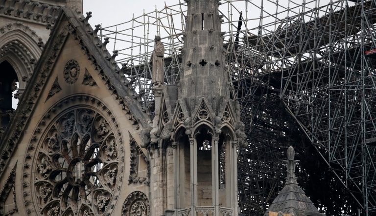 View of the scaffolding and damaged Notre Dame Cathedral after the fire in Paris, Tuesday, April 16, 2019.