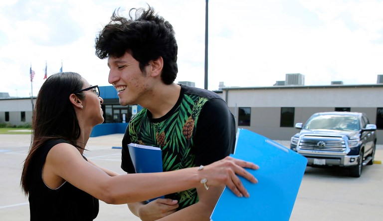 U.S. citizen Francisco Galicia, 18, gets a hug from his attorney, Claudia Galan, after his release from the South Texas Detention Facility in Pearsall, Texas, Tuesday, July 23, 2019.