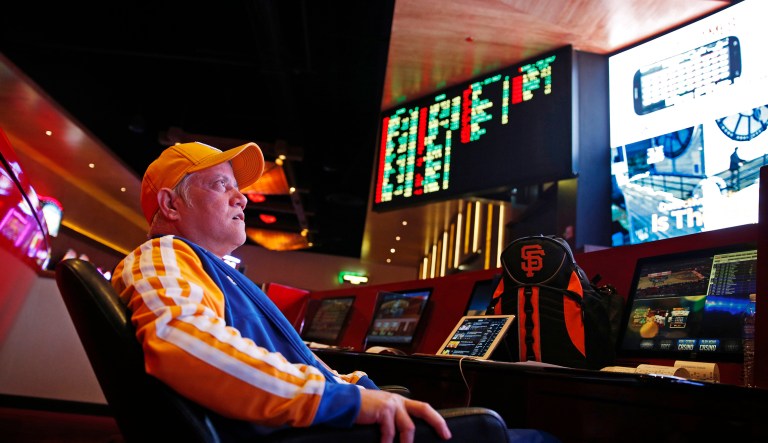 FILE â In this Jan. 14, 2015, file photo, Amado Nanalang watches basketball games while making bets at a sports book owned and operated by CG Technology in Las Vegas. The U.S. Supreme Court is set to hear arguments Dec. 4, 2017, as the state of New Jersey challenges a 1992 law forbidding state-authorized sports gambling in all but four states that met a 1991 deadline to legalize it: Delaware, Montana, Nevada and Oregon.