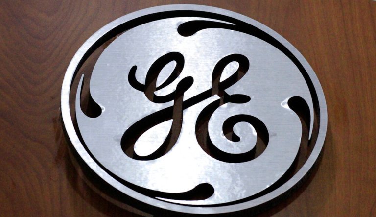 FILE - This Jan. 16, 2014 file photo shows the General Electric logo at a store in Cranberry Township, Pa.