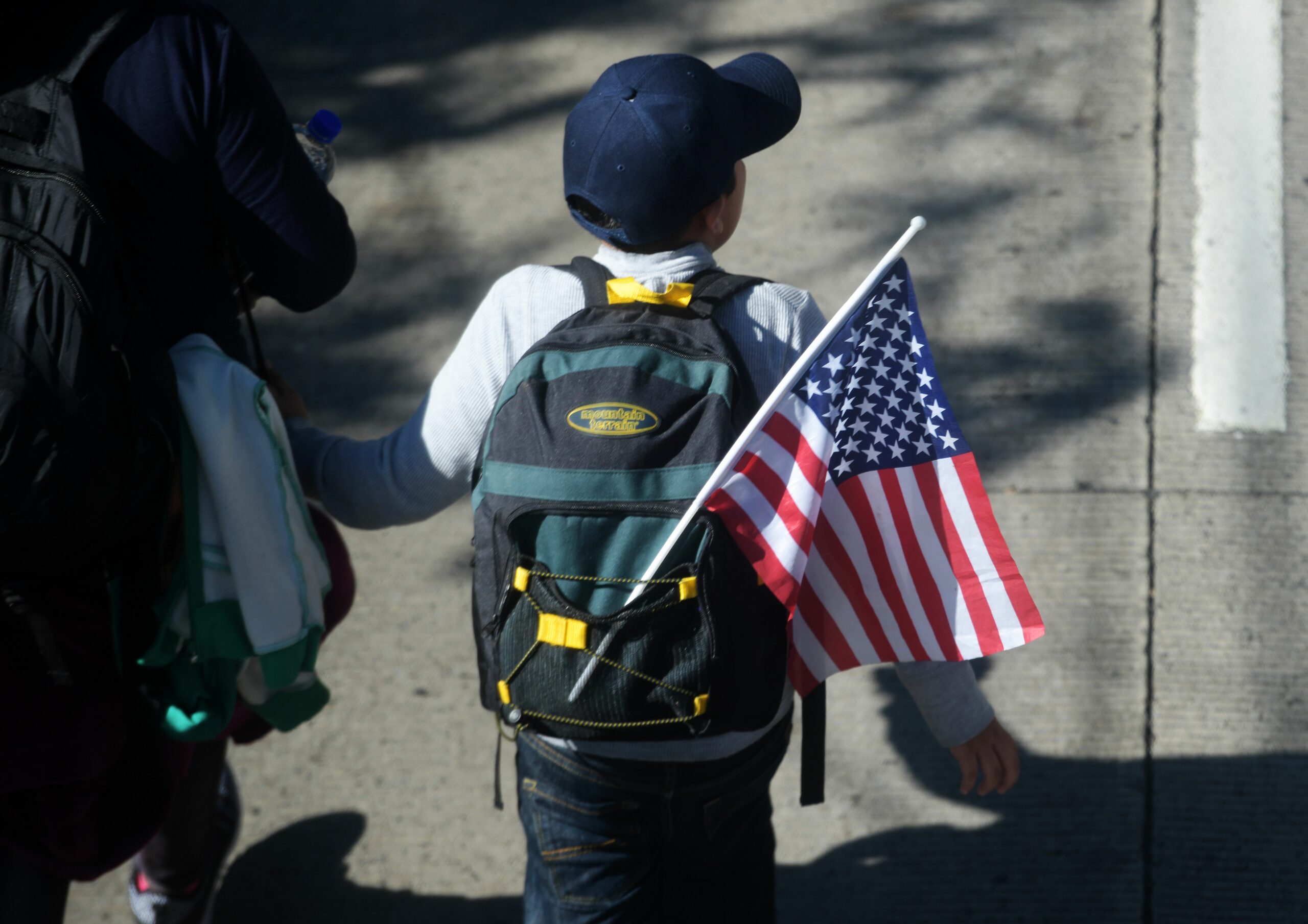 Fact Check: The Migrant Flag Burning Meme? Fake News.