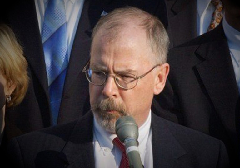 John Durham is seen at a press conference.