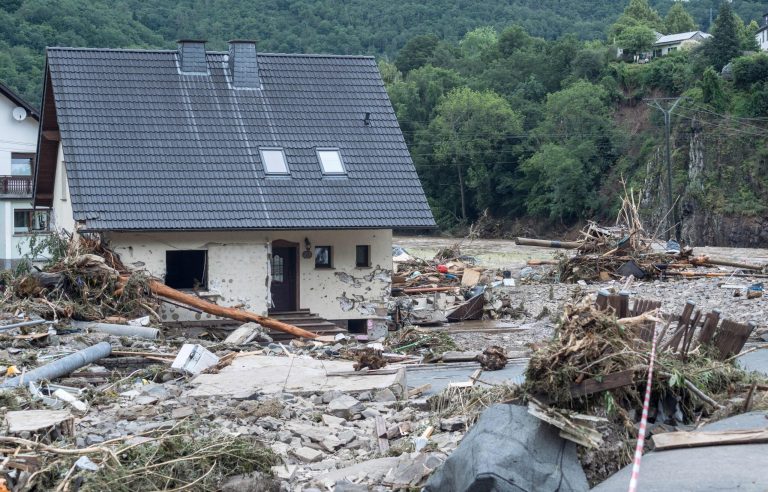 Merkel tours Western European flood zones as death toll climbs above 180