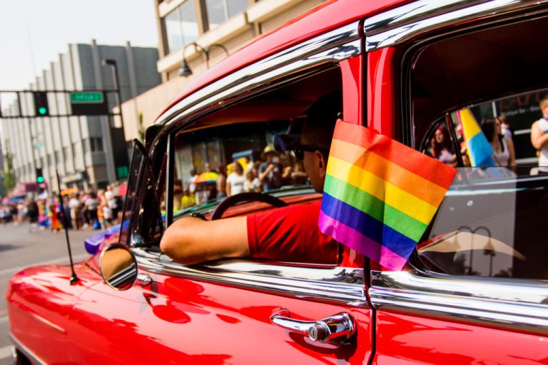 A classic car with a pride flag is seen during the Pride parade through the heart of Reno, Nevada, celebrated by thousands who came out for the event.