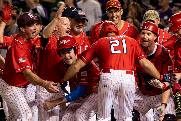 GOP batter Rep. Greg Steube, R-Fla., celebrates with the GOP team after hitting a home run during the Congressional Baseball Game at Nationals Park in Washington on Wednesday, Sept. 29, 2021. 