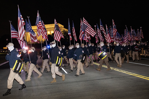 Members of the right-wing group Patriot Front march across Memorial Bridge in front of the Lincoln Memorial on December 04, 2021 in Washington, DC. Patriot Front broke off of the white nationalist group Vanguard America after the deadly âUnite the Rightâ rally in Charlottesville, Virginia in 2017. 