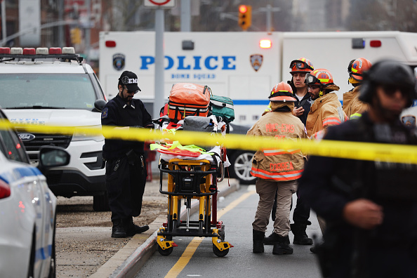 NEW YORK, NEW YORK - APRIL 12: Police and emergency responders gather at the site of a reported shooting of multiple people outside of the 36 St subway station on April 12, 2022 in the Brooklyn borough of New York City.