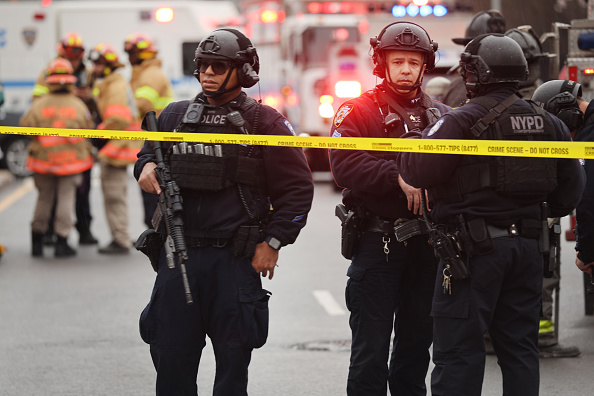 NEW YORK, NEW YORK - APRIL 12: Police and emergency responders gather at the site of a reported shooting of multiple people outside of the 36 St subway station on April 12, 2022 in the Brooklyn borough of New York City.