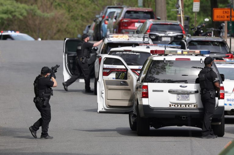 Person of interest connected to DC shooting found dead: Police Metropolitan Police point their weapons at a building Van Ness Street Northwest toward the scene of shooting on April 22, 2022 in Washington, DC. Police evacuated residents from the shooting scene Friday afternoon and there were reports of several shooting victims.
