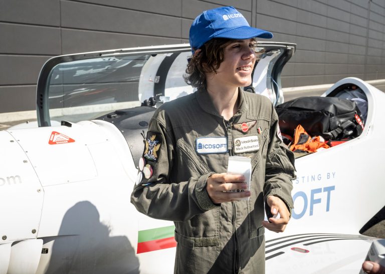 Seventeen-year-old Mack Rutherford talks to officials after landing at John Wayne Airport in Santa Ana, CA on Monday, August 8, 2022. Rutherford is attempting to be the youngest person to fly around the world solo in an aircraft. Rutherford, from Belgium, was making a pit stop along his route to 52 countries on five continents in five months.