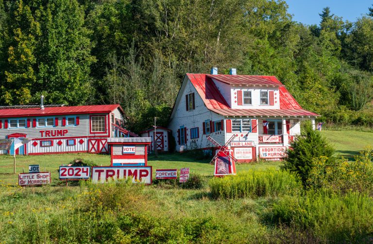 The house of a supporter of former President Trump is decorated with right-wing messages on Aug. 31 in Floyd, Virginia. President Biden won 54 percent of Virginia's 2020 presidential election.