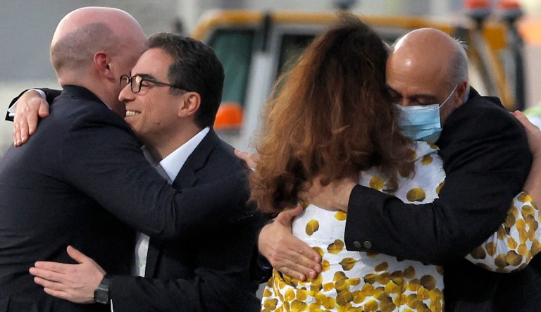 US citizens Siamak Namazi and Morad Tahbaz are welcomed by people upon disembarking from a Qatari jet upon their arrival at the Doha International Airport in Doha on Sept. 18, 2023. Five U.S. detainees, three previously identified as Siamak Namazi, Morad Tahbaz, and Emad Sharqi and two who wish to remain anonymous, released by Iran landed in Doha in a prisoner swap on Sept. 18 after $6 billion in frozen funds were transferred to Iranian accounts in Qatar.