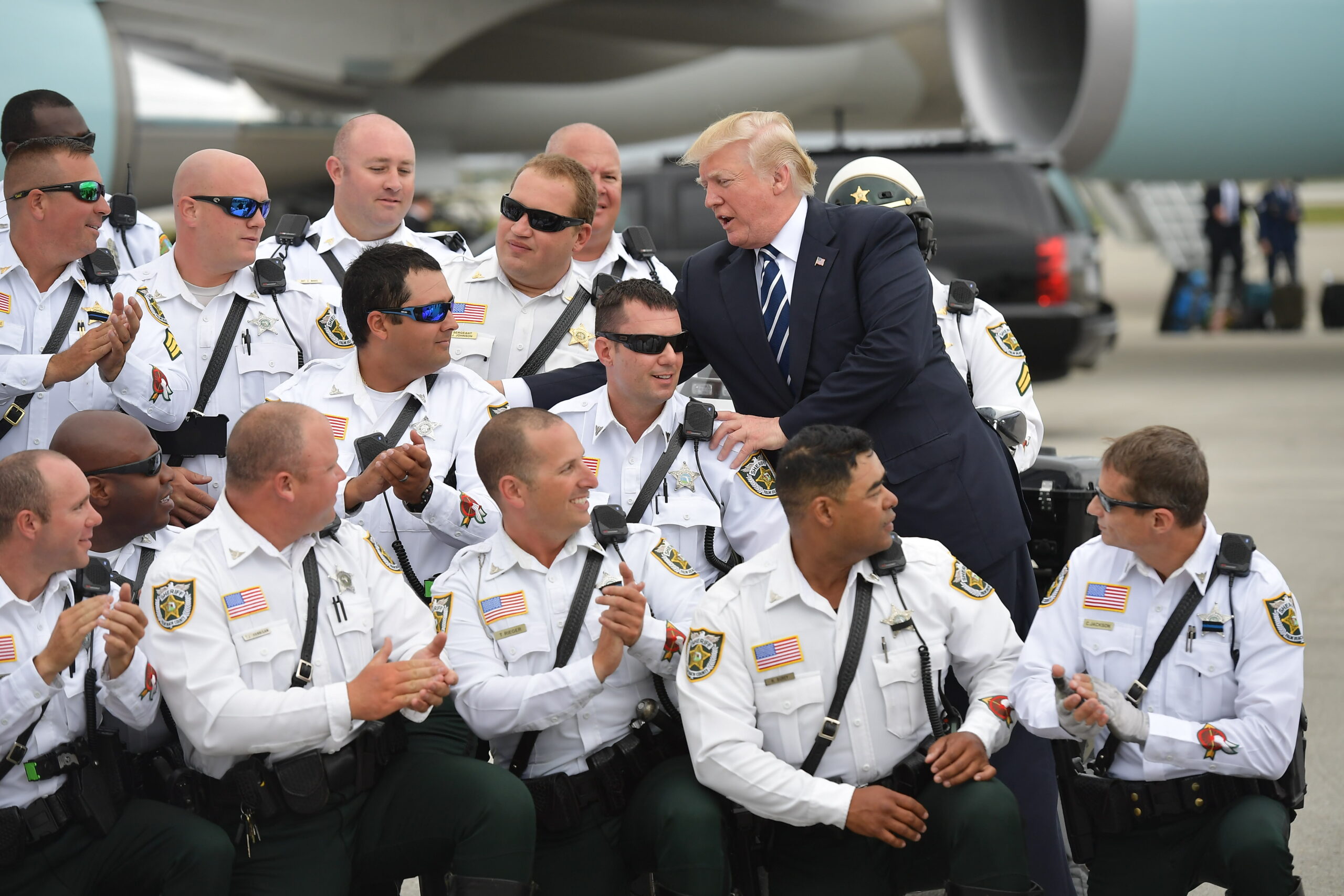 Donald Trump and Police Officers on Tarmac