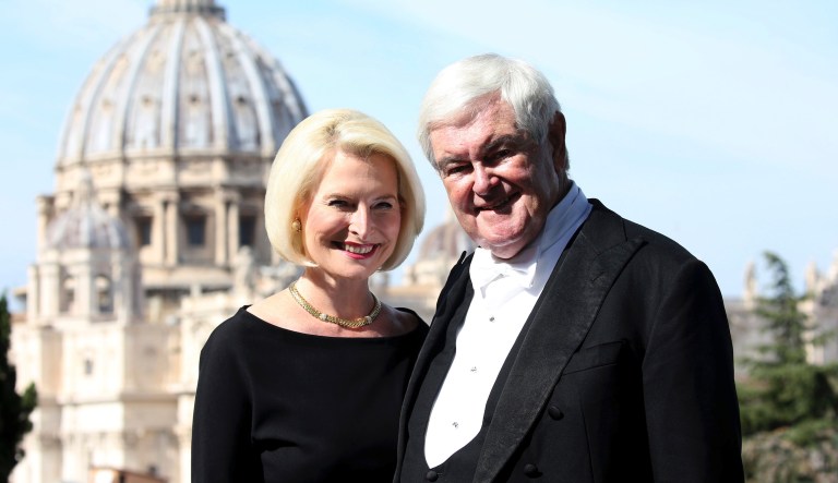 Newt Gingrich and US ambassador at the Holy See Callista Gingrich pose in front the St. Peter's Basilica during a reception for the Cardinal Newman Canonization at Pontifical Urban College, Sunday, Oct. 13, 2019 in Vatican City, Vatican. Pope Francis on Sunday canonized Cardinal John Henry Newman, the 19th-century Anglican convert who became an immensely influential, unifying figure in both the Anglican and Catholic churches.