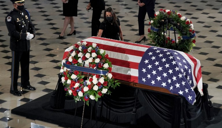 Rep. Nanette Barragan, D-Calif., pays respects at the flag-draped casket of Justice Ruth Bader Ginsburg lying in state in Statuary Hall of the U.S. Capitol, Friday, Sept. 25, 2020, in Washington. Ginsburg died at the age of 87 on Sept. 18 and is the first women to lie in state at the Capitol.