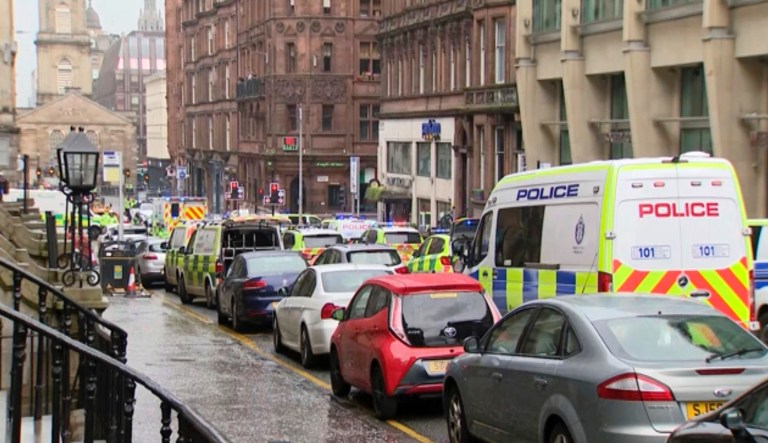In this image taken from SKY video, emergency services attend the scene of incident in Glasgow, Scotland, Friday June 26, 2020. Police in Glasgow say emergency services are currently dealing with an incident in the center of Scotland's largest city and are urging people to avoid the area. 