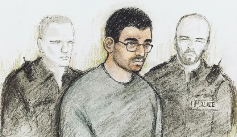 Court artist sketch by Elizabeth Cook of Hashem Abedi in the dock at Westminster Magistrates' Court where he is appearing following his extradition from Libya, in London, Thursday July 18, 2019. The brother of the suicide bomber who killed almost two dozen people at an Ariana Grande concert in Manchester appeared in court Thursday to face 22 charges of murder.