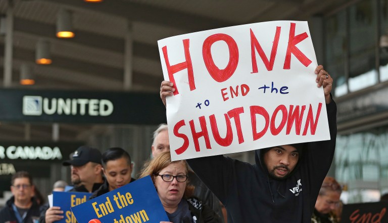 More than two dozen federal employees and supporters demonstrate at the Sacramento International Airport calling for President Donald Trump and Washington lawmakers to end then partial government shutdown, Wednesday, Jan. 16, 2019, in Sacramento, Calif.