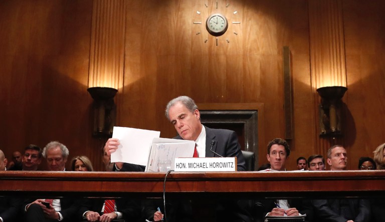Department of Justice Inspector General Michael Horowitz looks over his papers before testifying at a Senate committee on FISA investigation hearing, Wednesday, Dec. 18, 2019, on Capitol Hill in Washington.