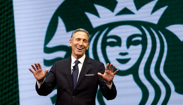 FILE - In this March 22, 2017 file photo, Starbucks CEO Howard Schultz speaks at the Starbucks annual shareholders meeting in Seattle. Schultz says the company will now allow people to use bathrooms at its coffee shops even if they donât buy anything, as it continues to take a closer look at its operations following the arrest of two black men at a Philadelphia shop. Schulz discussed the new policy while he spoke at the Atlantic Council in Washington, Thursday, May 10, 2018. Schultz said the company previously had a âloose policyâ that only paying customers be allowed to use bathrooms, but that it was up to each store manager to decide.