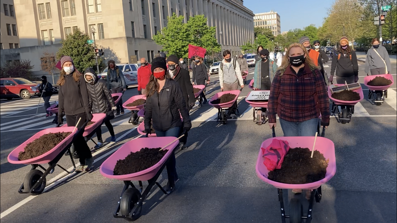 Activists dump ‘bulls—‘ at White House ahead of Biden climate summit